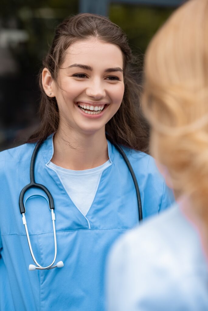 smiling medical student talking with lecturer